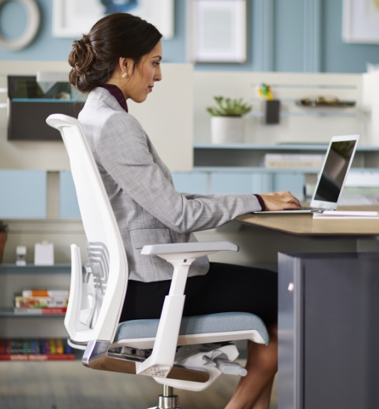 Woman on ergonomic chair 